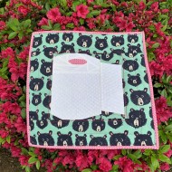 Completed Keep Calm and Roll On mini quilt on a beautiful azalea